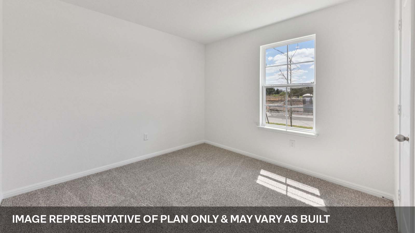 Bedroom 2 with carpeted flooring.