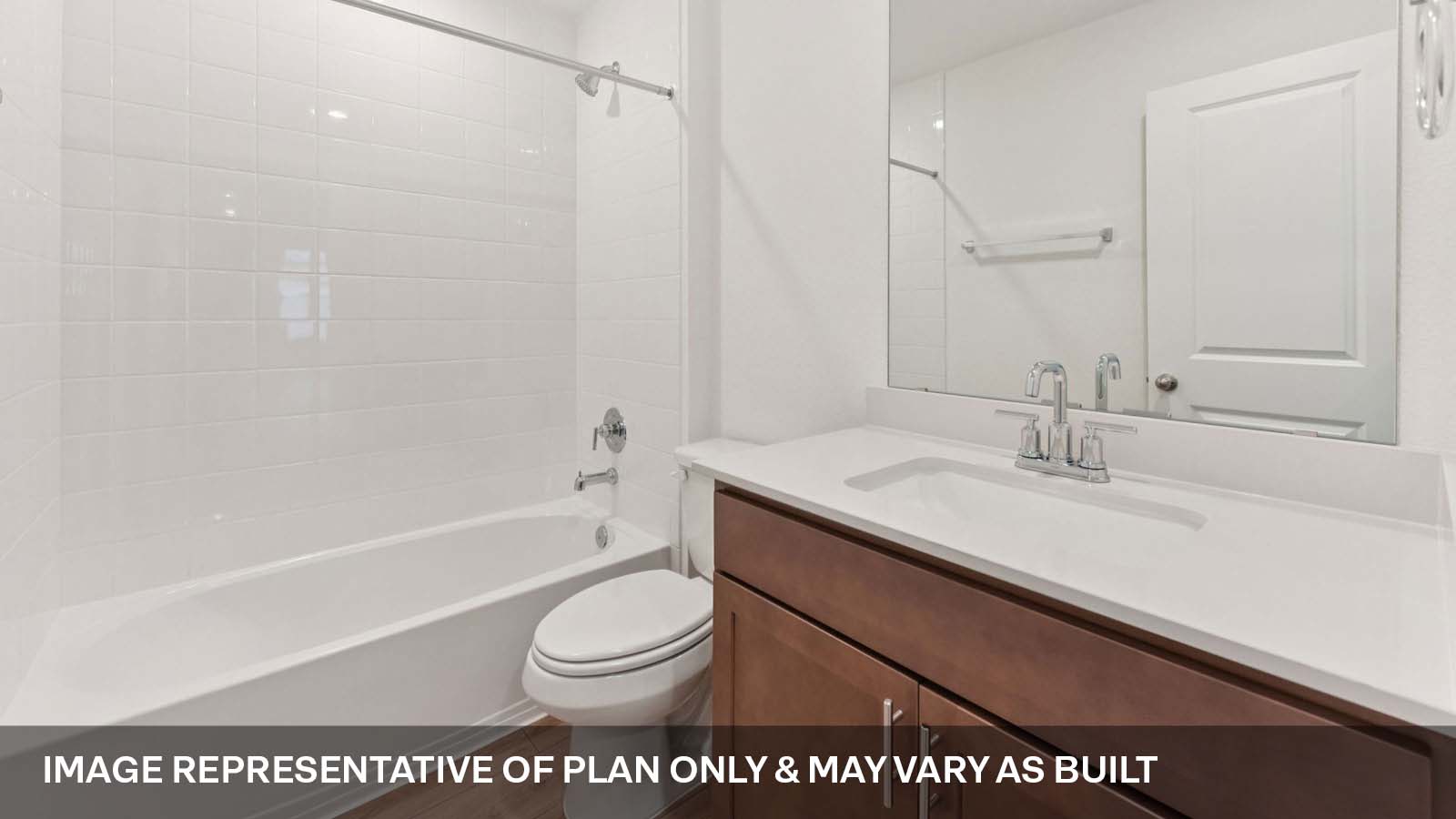 Secondary bathroom with tub and raised shower head.