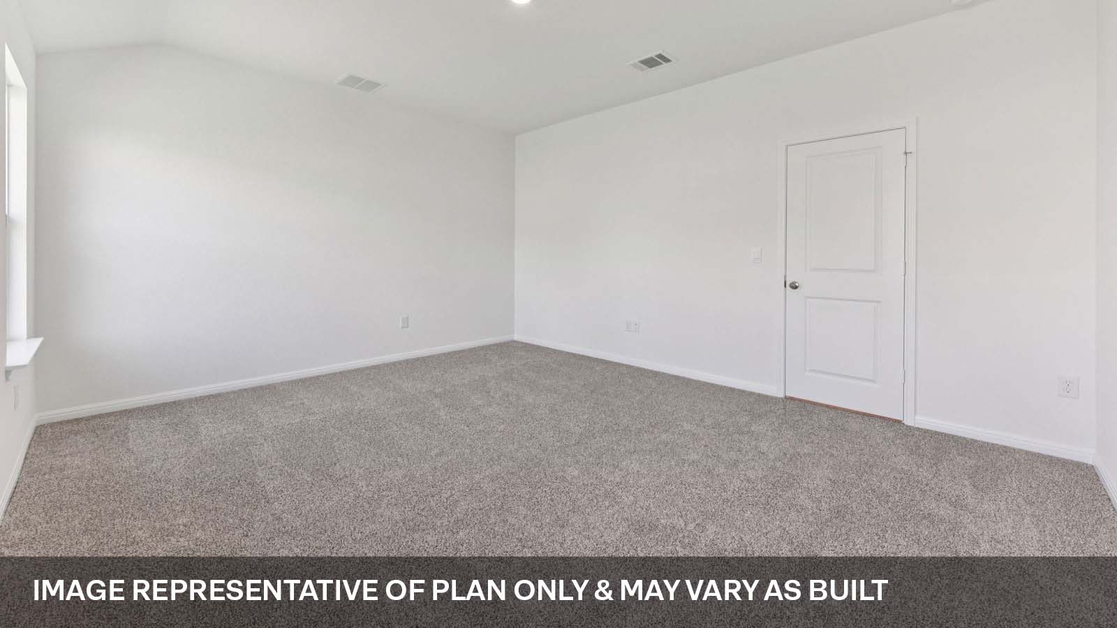 Primary bedroom with carpeted flooring and two windows.