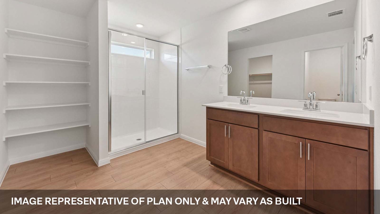 Luxurious primary bathroom with walk-in shower and quartz vanity.