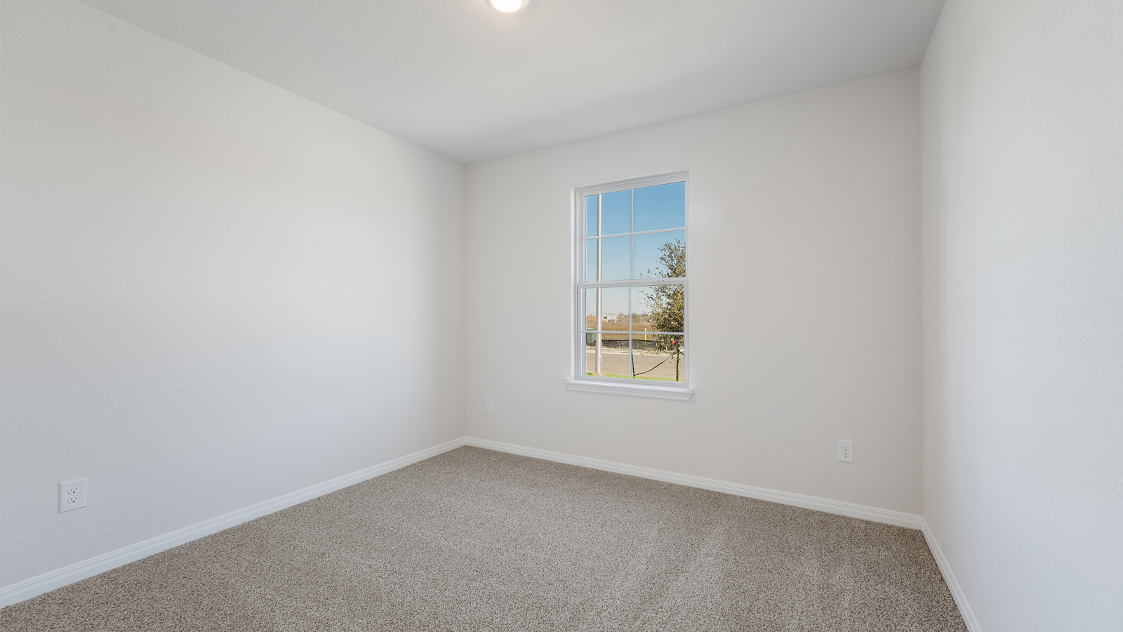 Bedroom 2 with carpeted flooring.