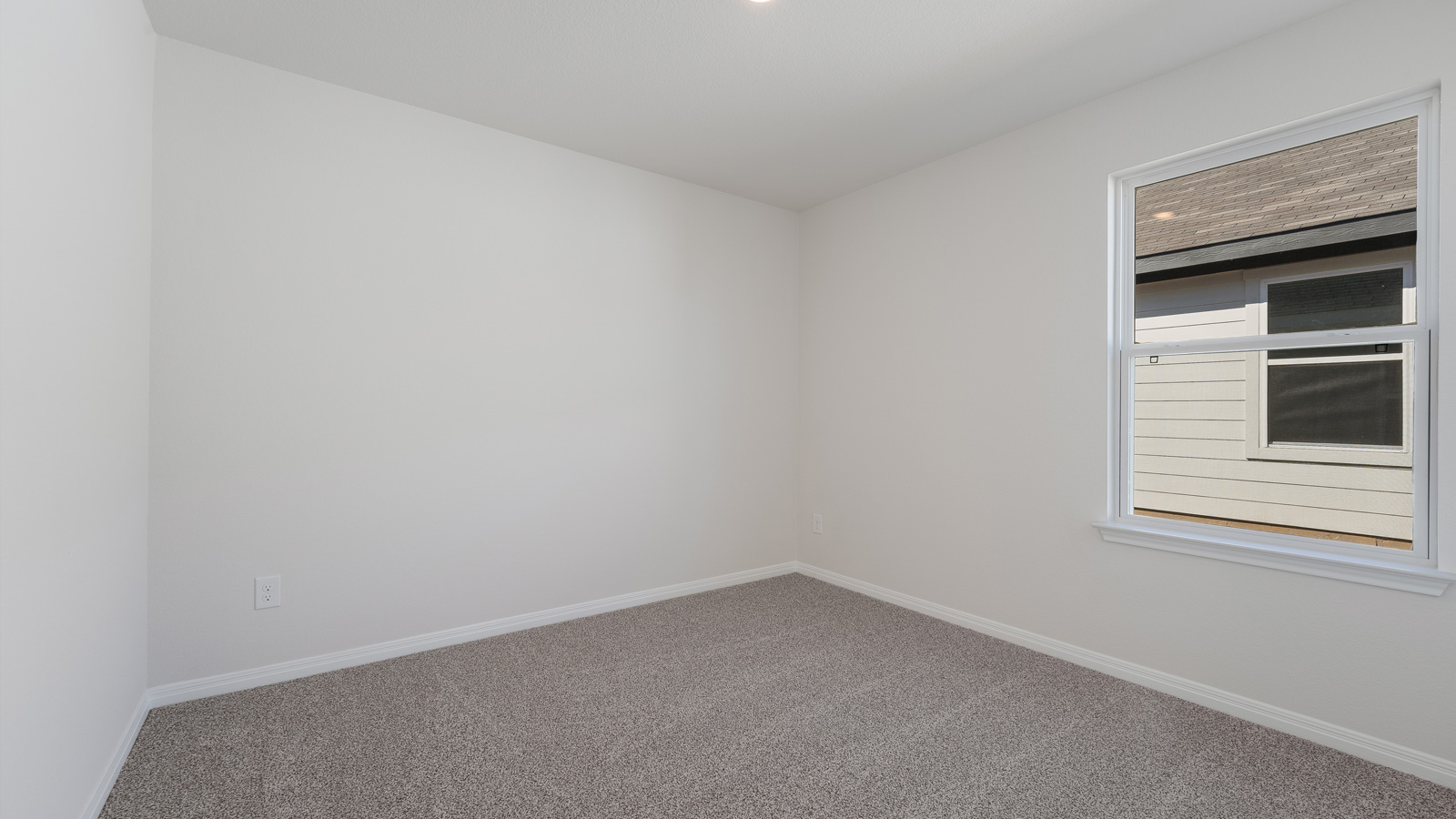 Bedroom 3 with carpeted floors.