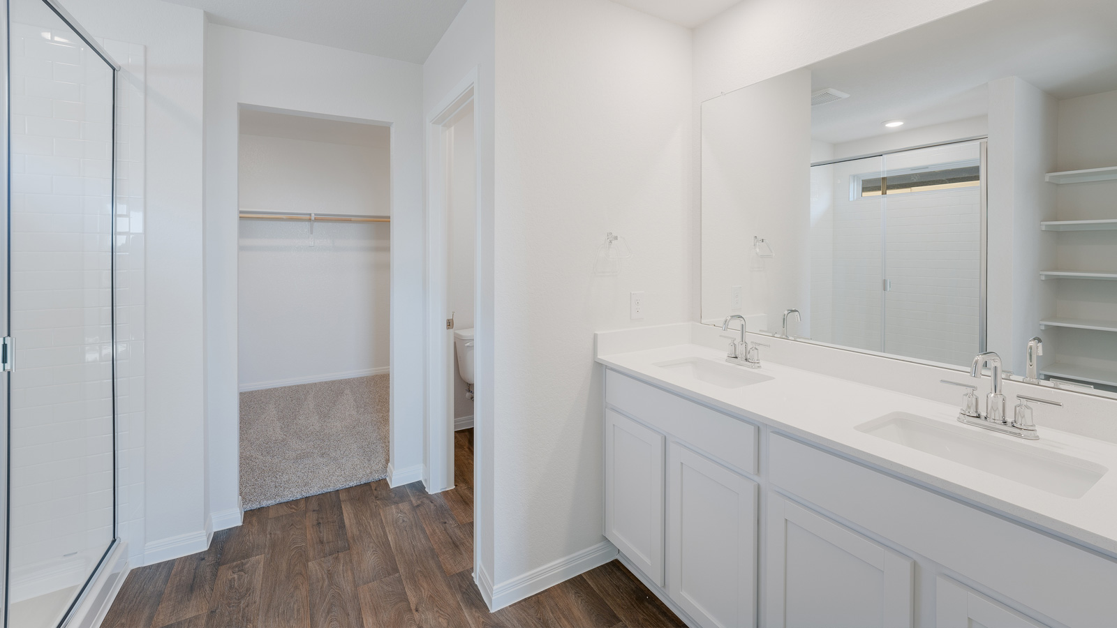 The main bathroom, bathroom 1, with walk-in shower and double vanity sink.