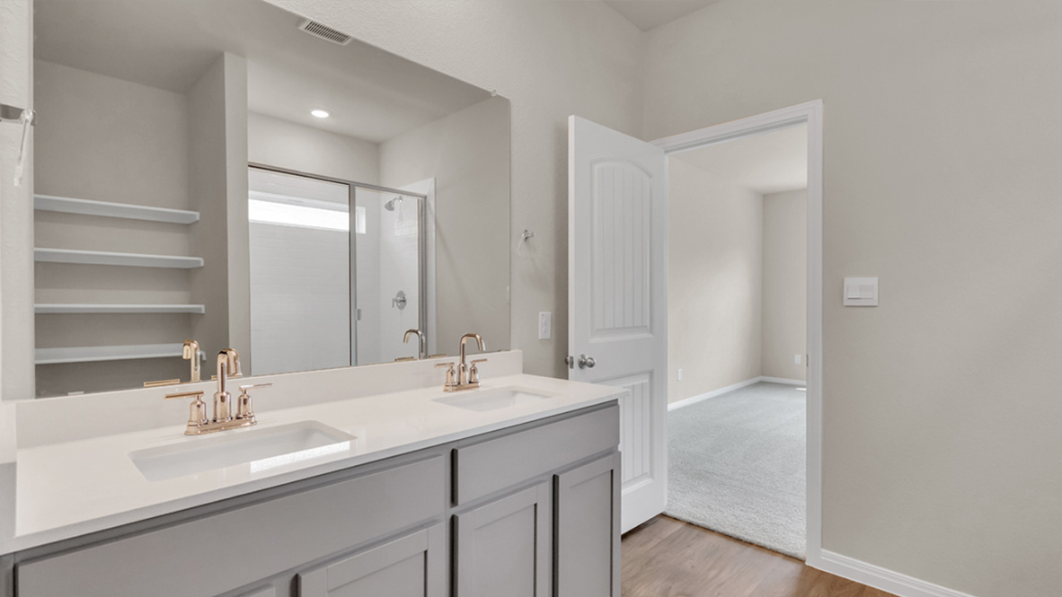 Owner’s ensuite in a new build home offers function and style with a walk-in closet, spa-like ensuite