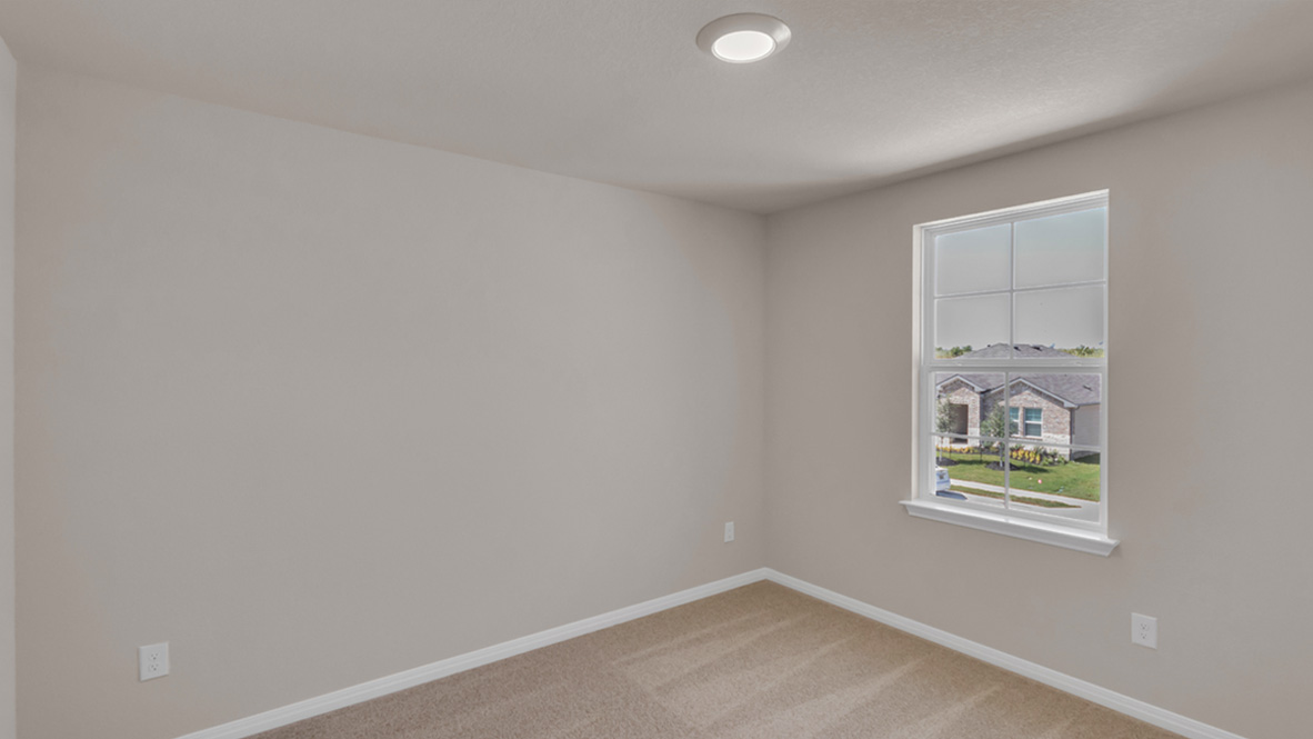 Secondary bedroom design includes ample square footage, privacy from the primary suite, and a centrally accessible to home