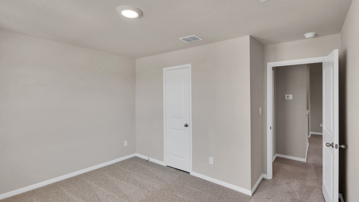 Secondary bedroom in Carillon showcases soft carpet, a single closet, soft window light, multi-use potential