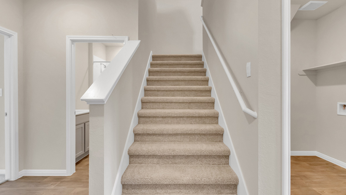 Stair access upstairs, loft and multi-use space, bedrooms and guest-family bathroom Carillon