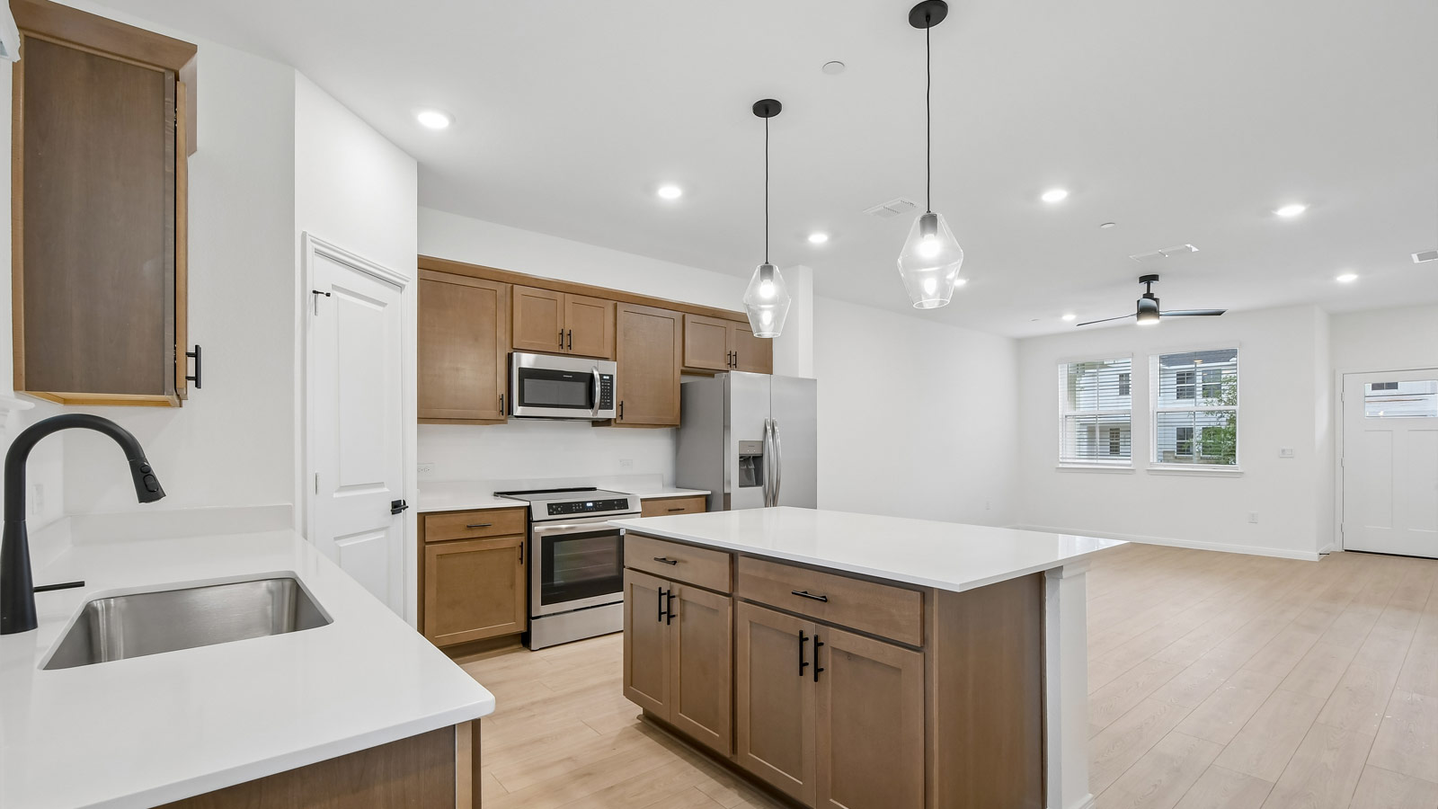 Quartz countertops in kitchen.