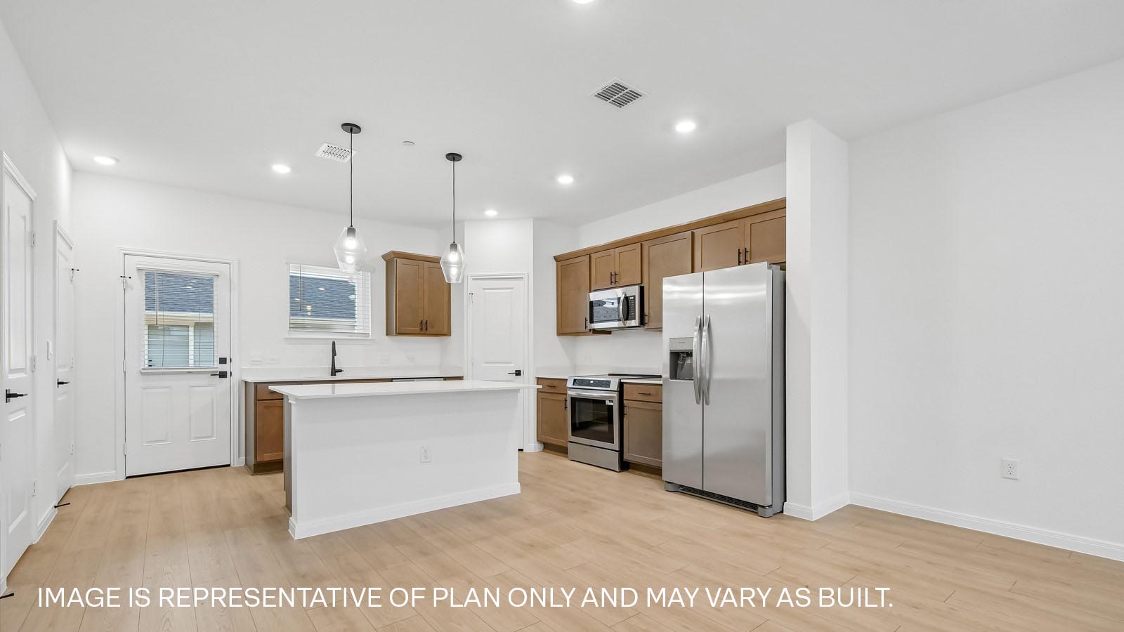 Stainless steel range, microwave, and dishwasher in kitchen.