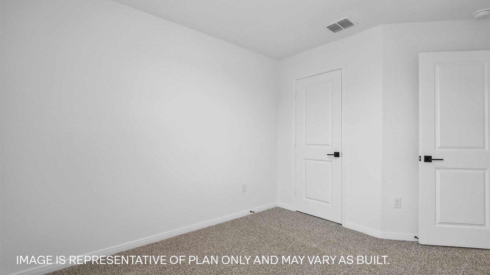 Bedroom 3 with carpeted flooring and window.