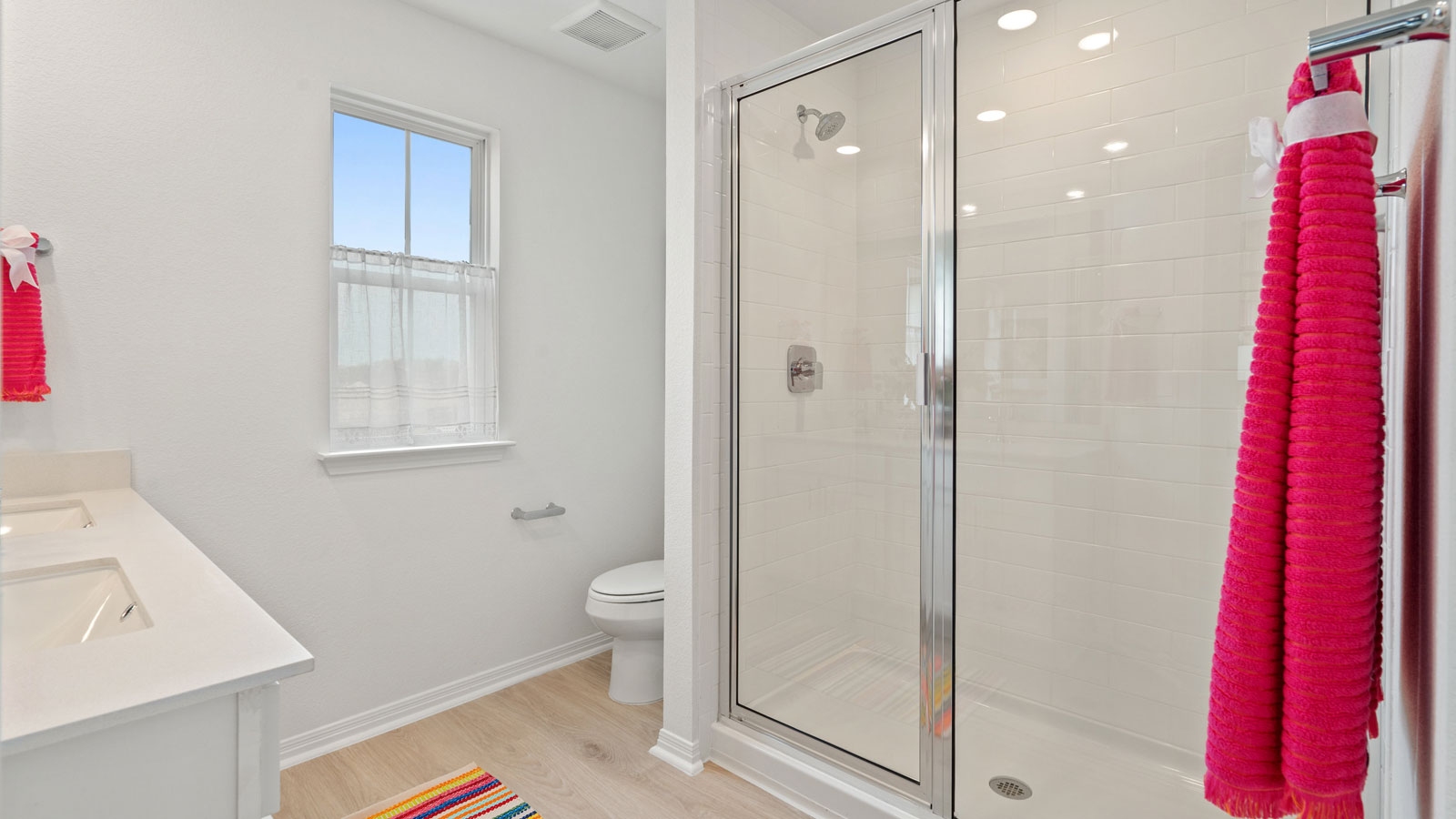 Bathroom 1 with double vanity sink and walk-in shower.