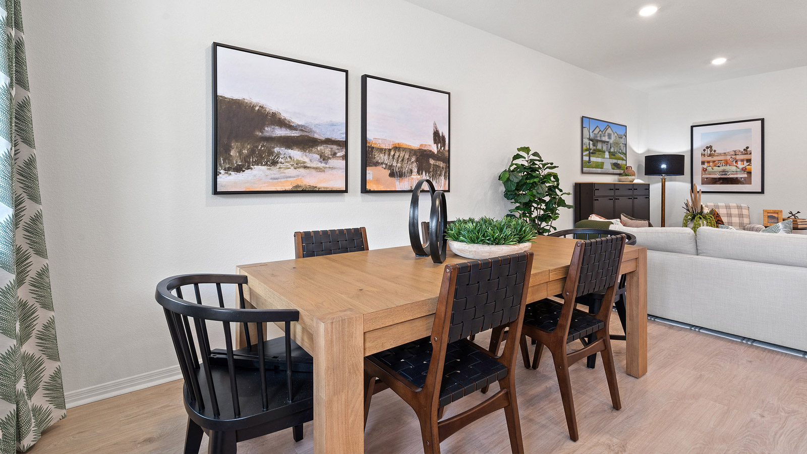Living room with view into dining and kitchen, with new appliance suite included and cabinet options