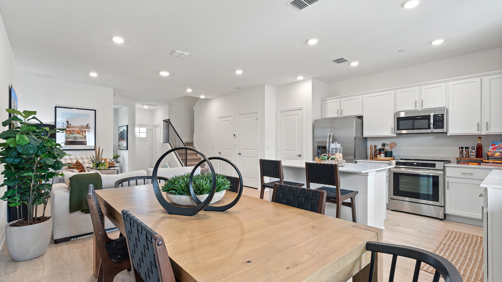 View from dining room to modern designed kitchen with pantry, new appliance suite included, stair entry Avery Centre