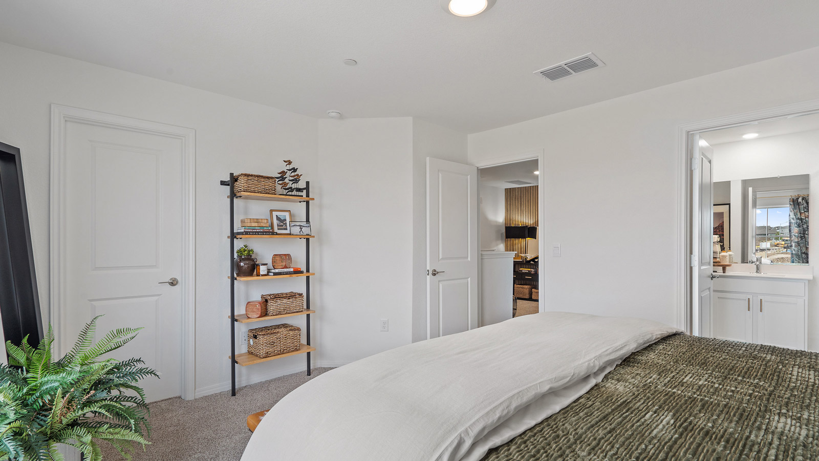 Primary bedroom designed with privacy and comfort design, flowing into our spa-inspired ensuite, walk-in closet on main level