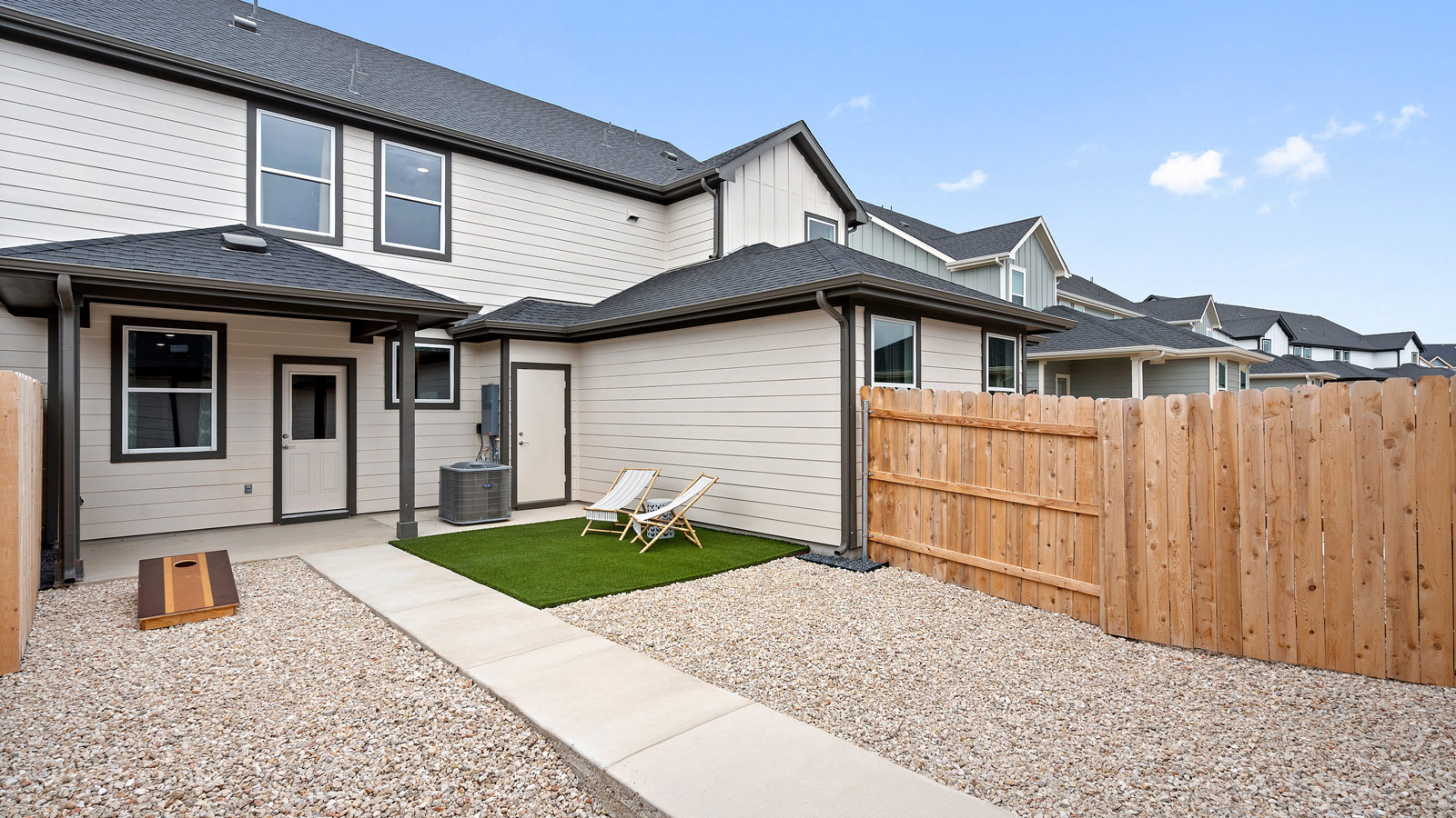 Covered rear patio in this D.R. Horton new home with outdoor living and private backyard views Avery Centre By D.R. Horton