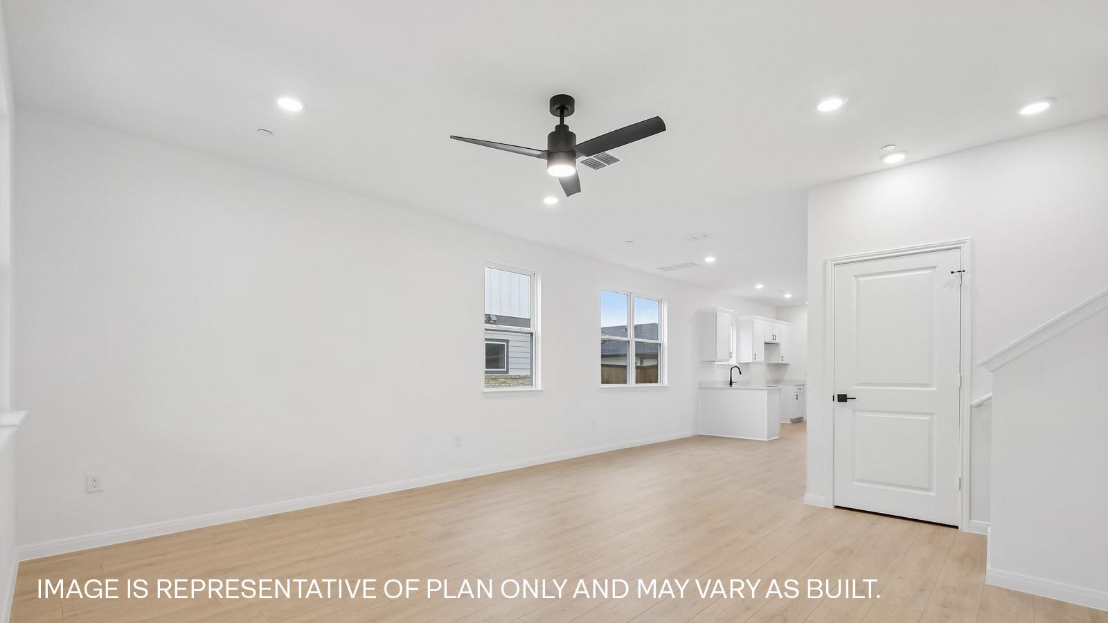 Living area with premium laminated wood plank flooring.