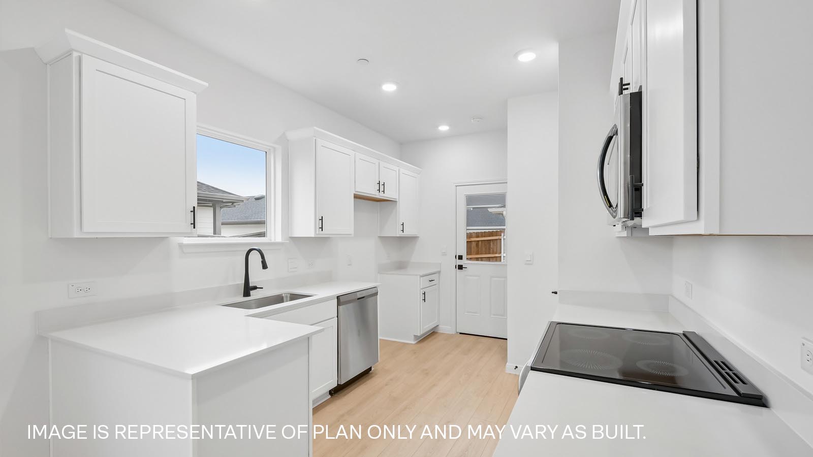 Stainless steel range, microwave, and dishwasher.