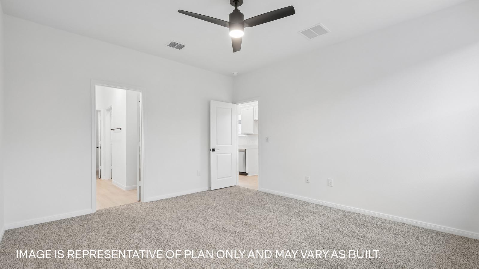 Spacious main bedroom with carpeted flooring, ceiling fan, and windows.
