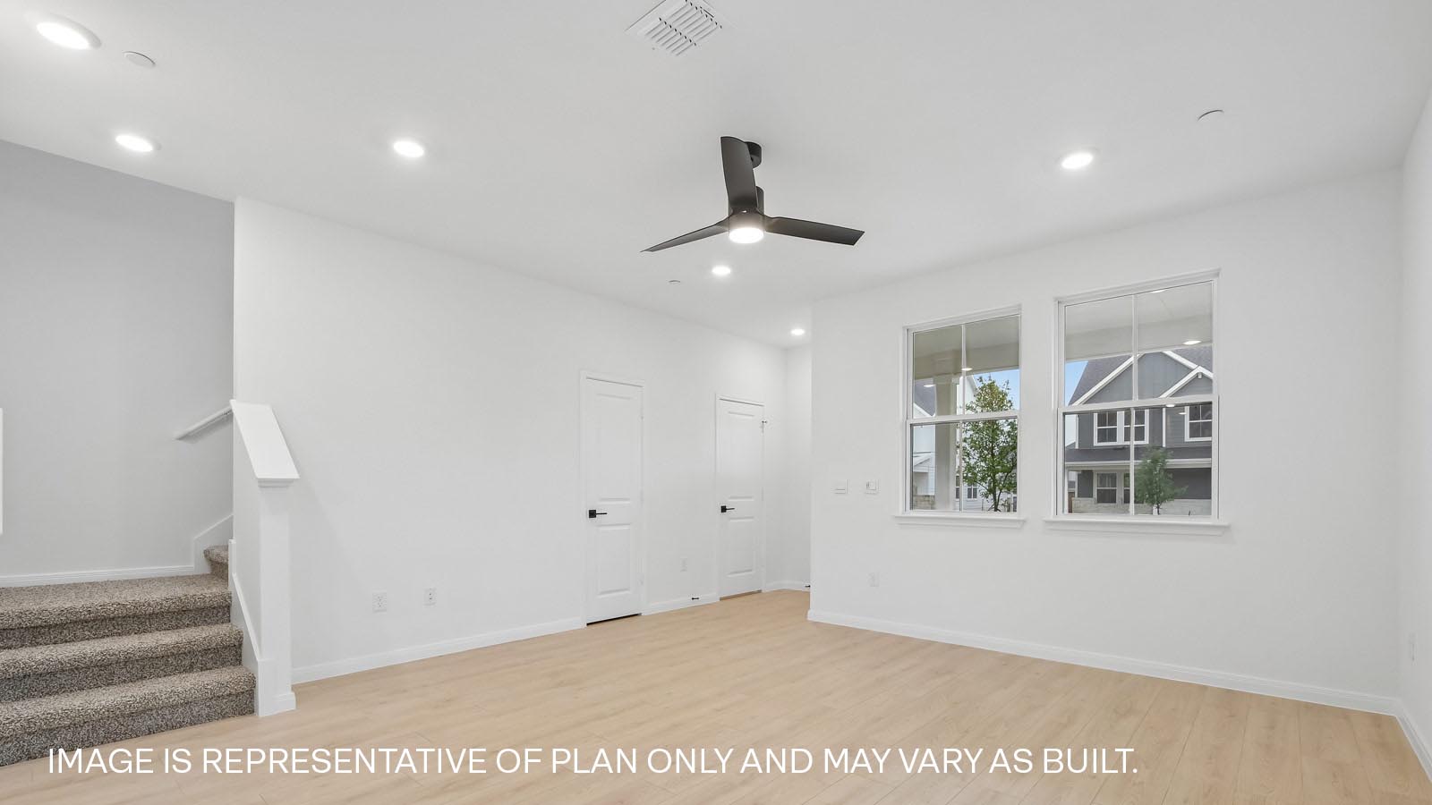 Living area with premium laminated wood plank flooring.
