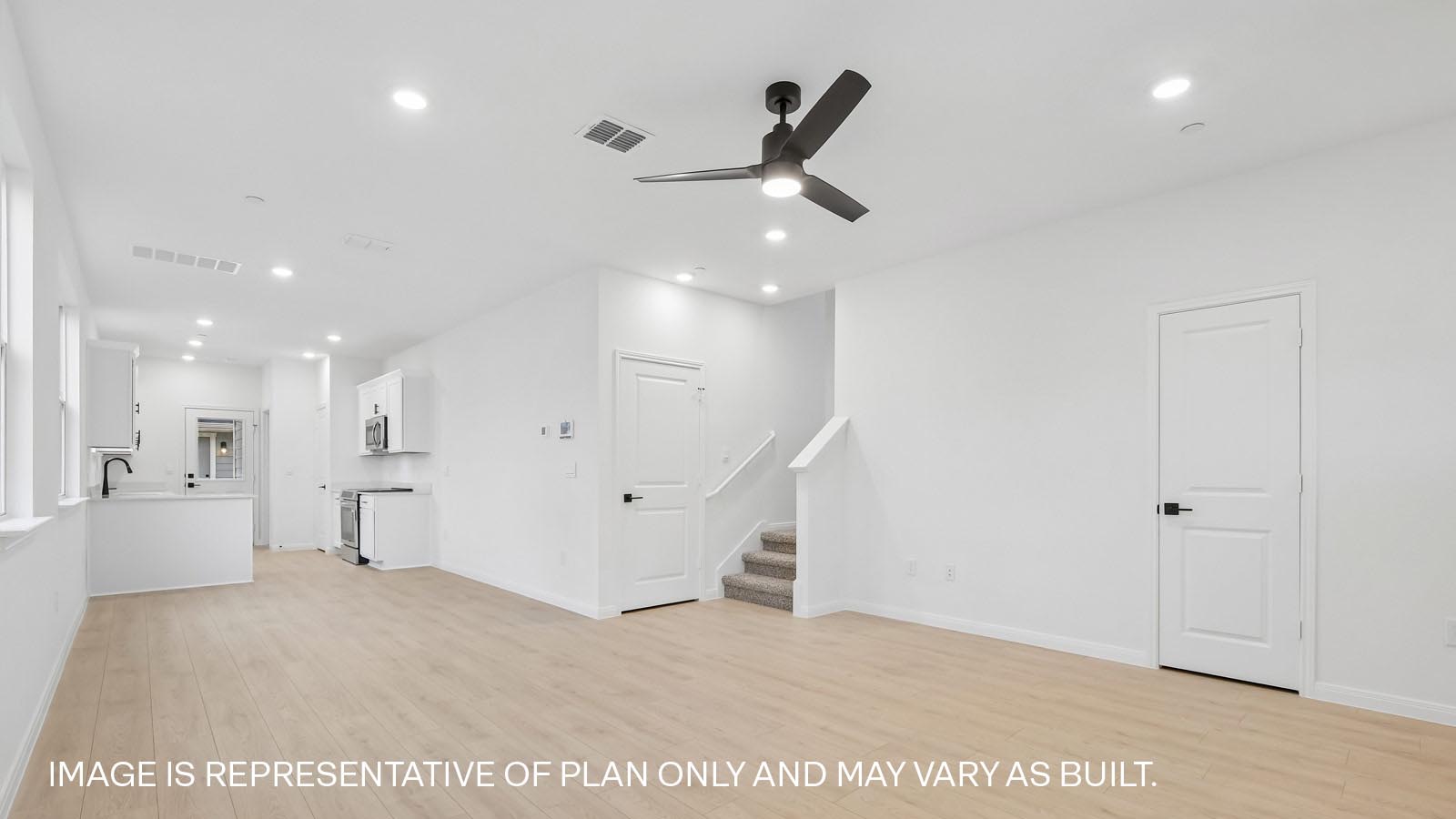 Living area with ceiling fan.