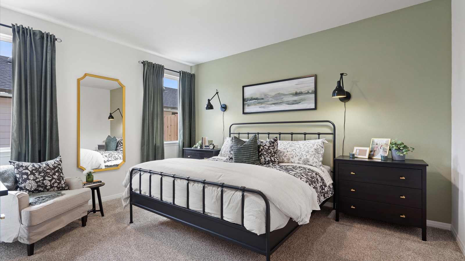 Primary bedroom with large windows.