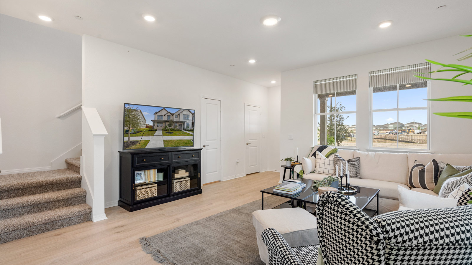 Open living room with two windows.
