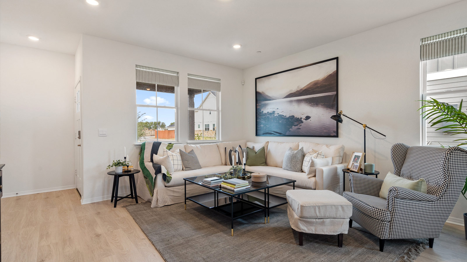 Open living room with two windows.