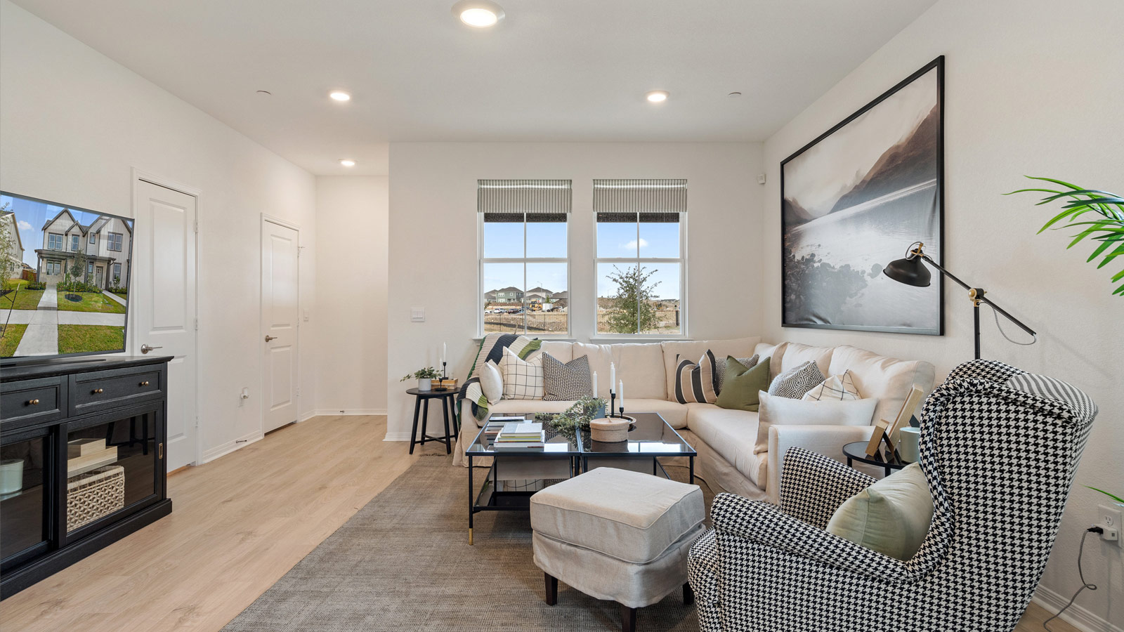 Open living room with two windows.