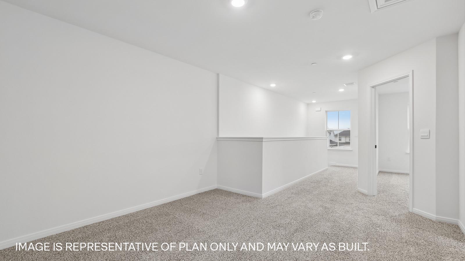 Upstairs area with carpeted flooring.