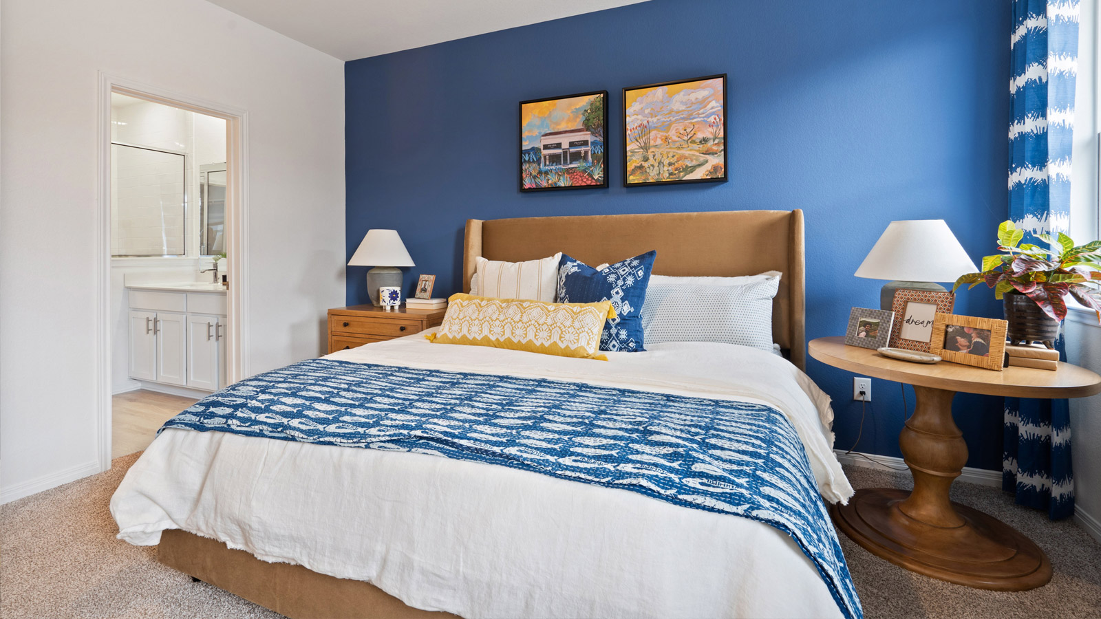The main bedroom, bedroom 1, with window and carpeted floors.