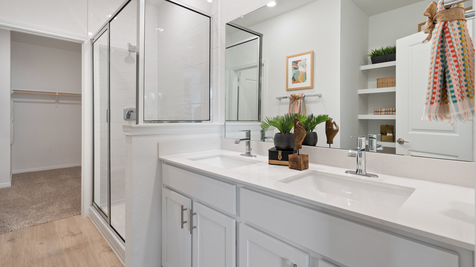 Spacious bathroom 1 with double vanity sink and walk-in shower.