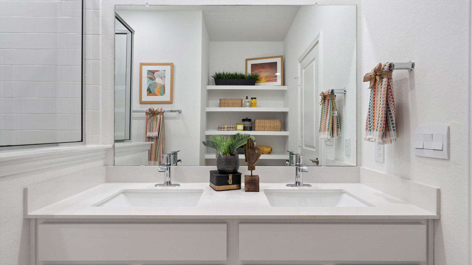 Spacious bathroom 1 with double vanity sink and walk-in shower.