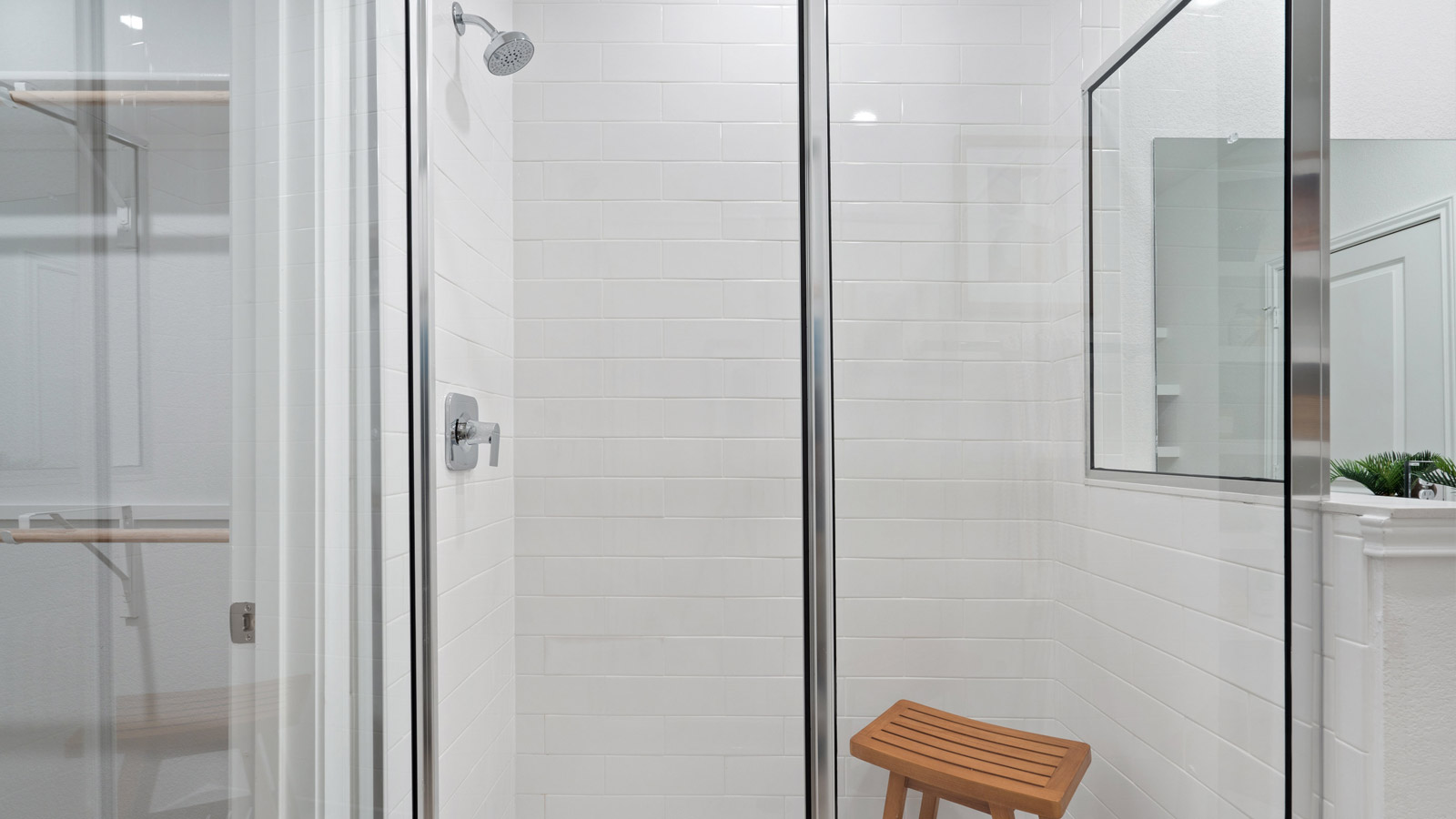 Spacious bathroom 1 with double vanity sink and walk-in shower.