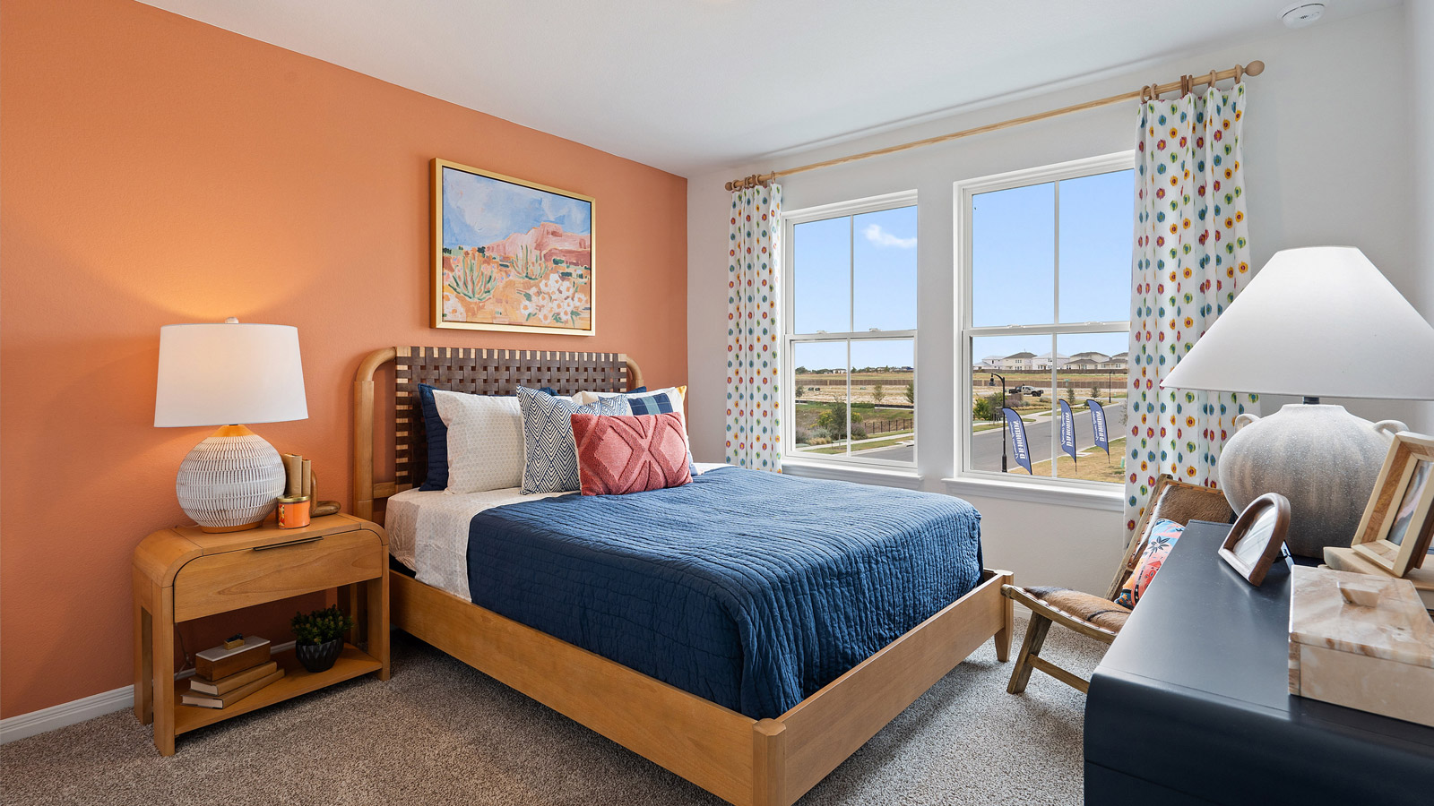 Bedroom 3 with window and carpeted floors.