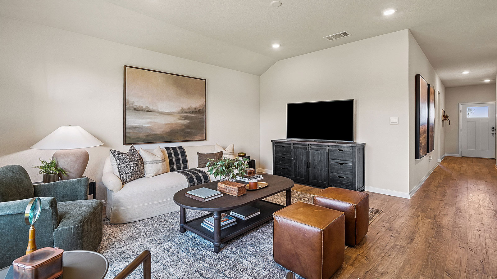 Main living area with clean flooring and natural light.