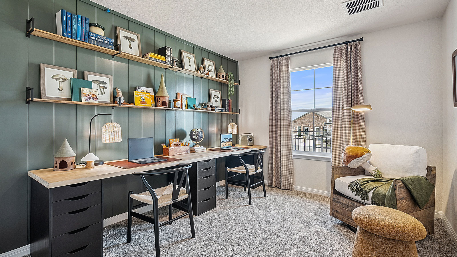 Office space with neutral carpet, natural light, and simple decor.