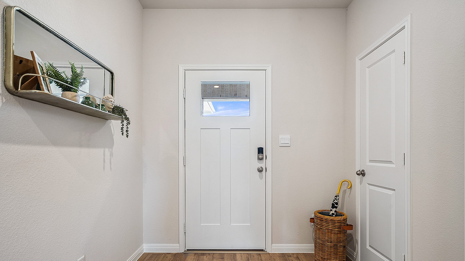 Entryway with bright hallway.