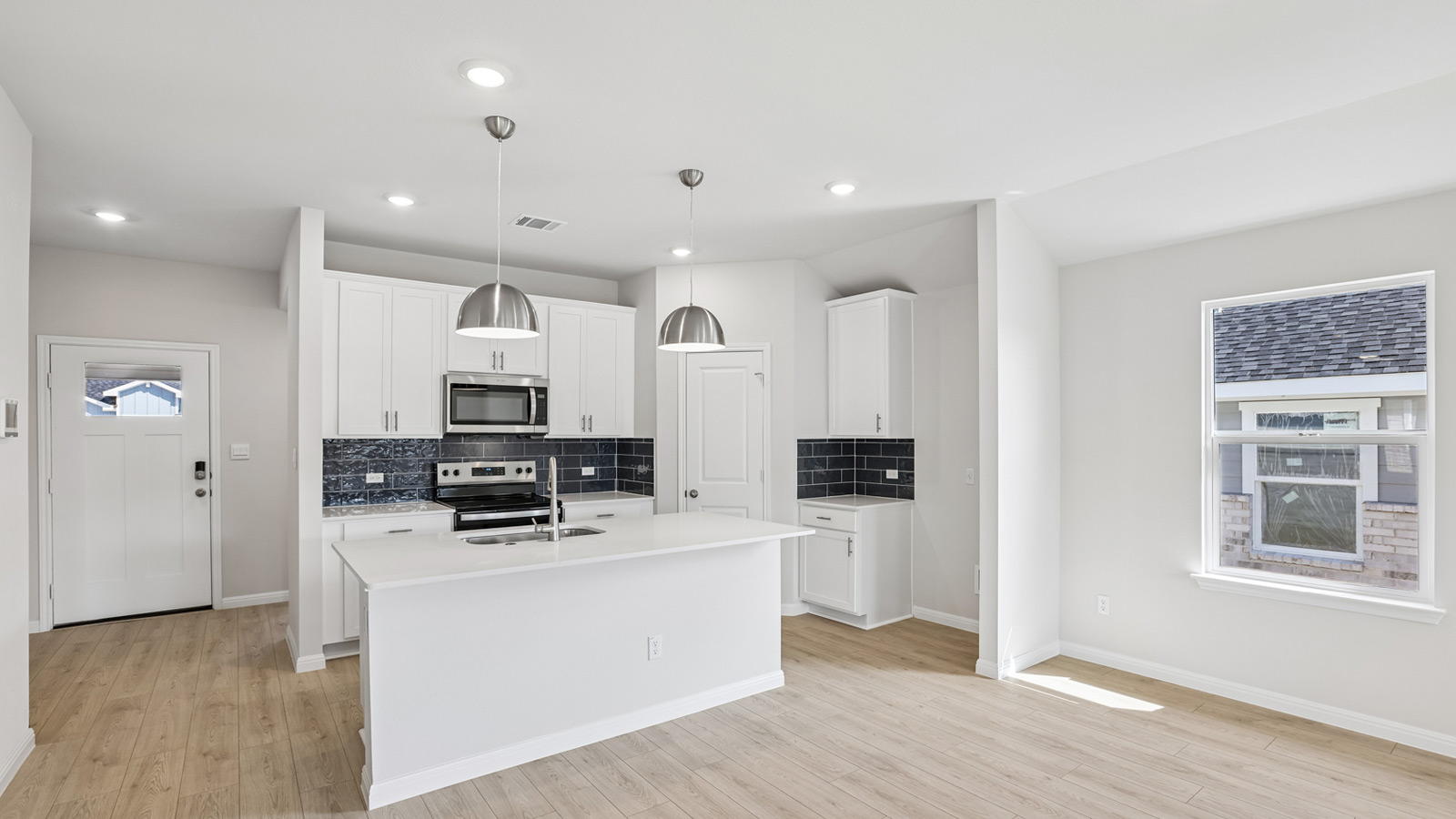 Kitchen and dining area with window.
