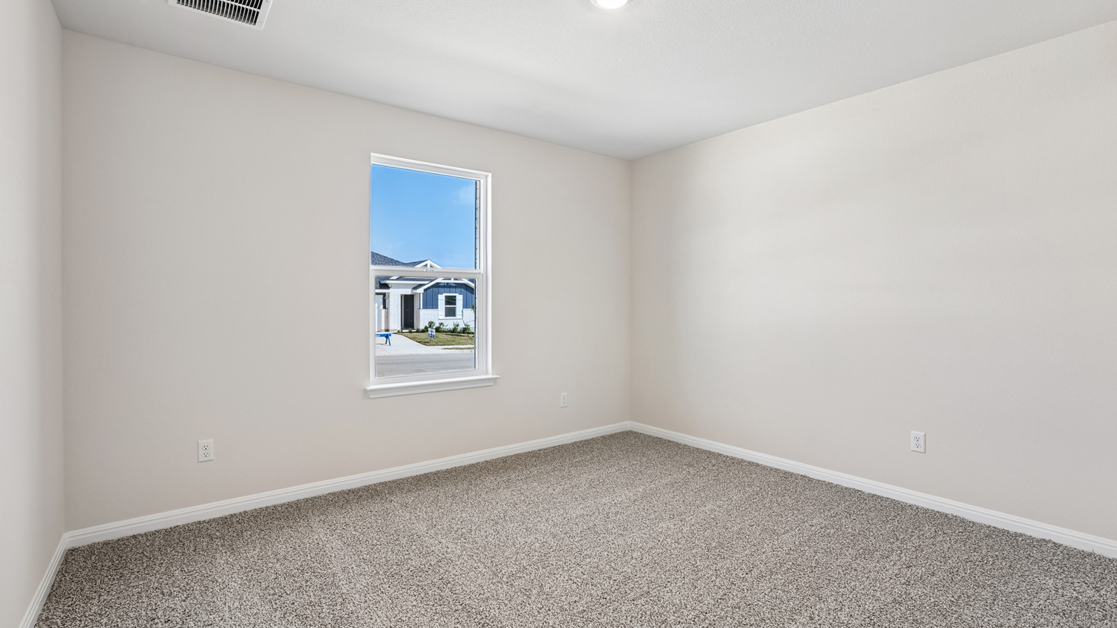 Bedroom 2 with carpeted flooring and window.
