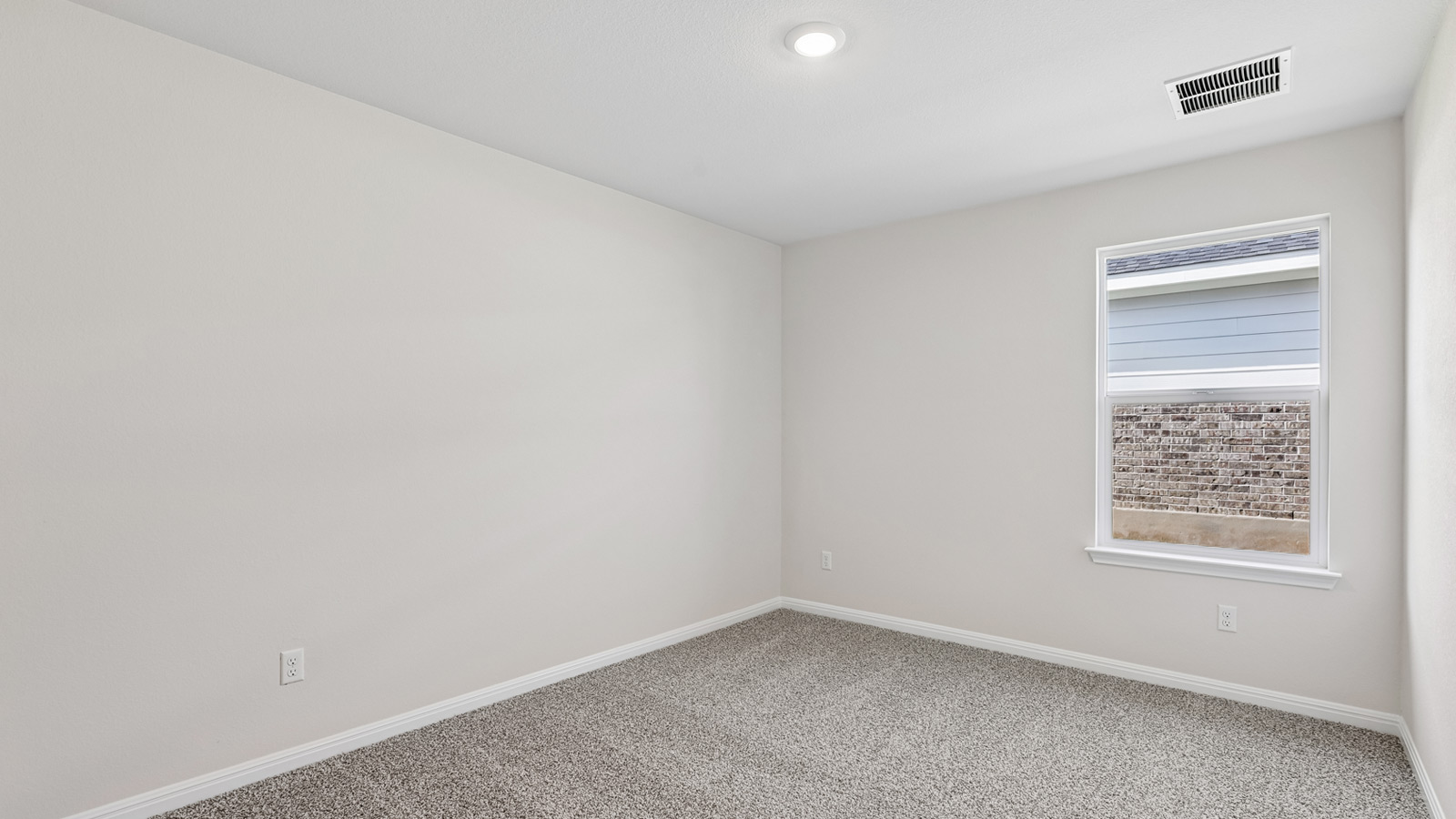 Bedroom 3 with carpeted flooring.