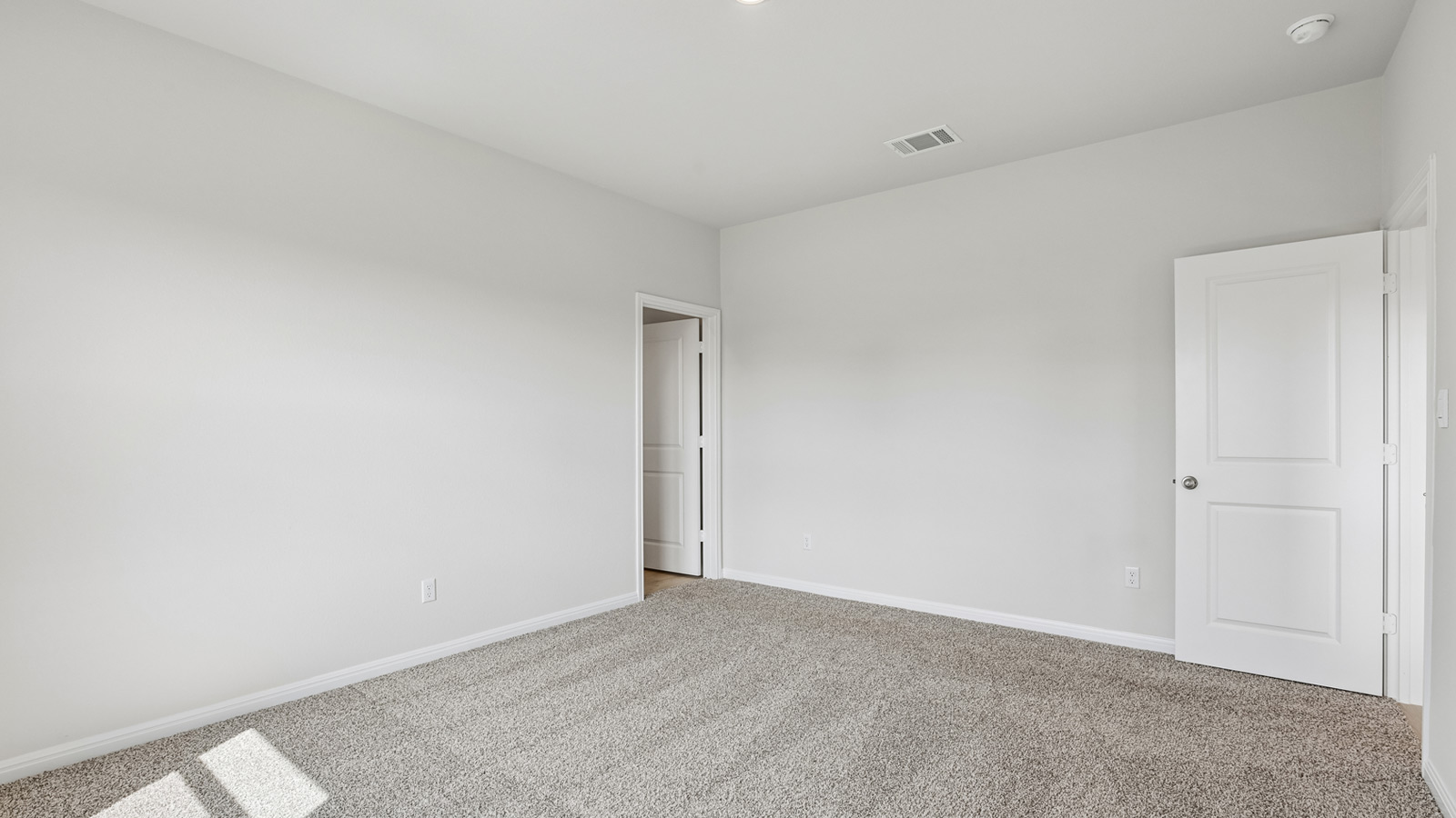 Primary bedroom with ensuite bathroom.