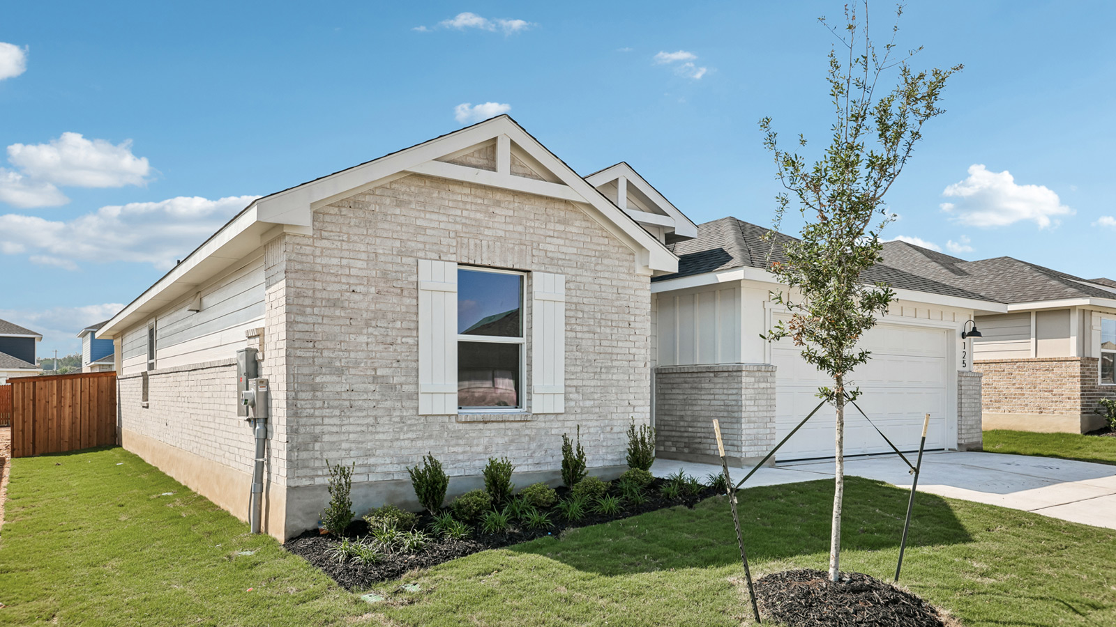 Side exterior shot of 125 Southridge Trail at Thunder Rock in Marble Falls, TX.