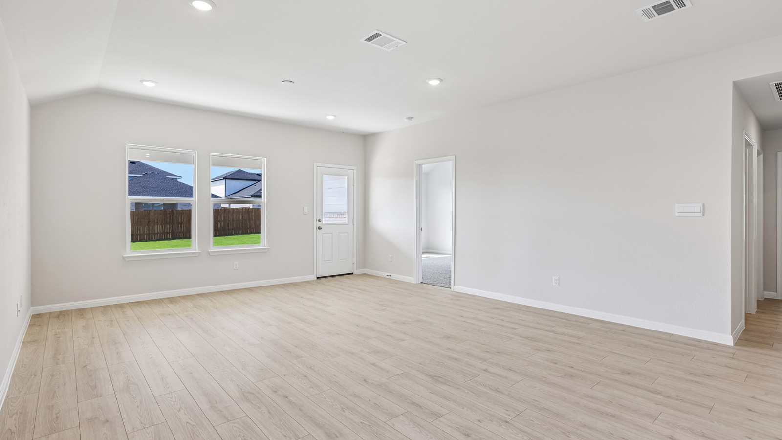 Living area with premium laminate wood plank flooring.