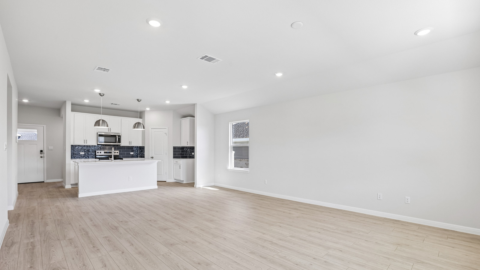 Living area with premium laminate wood plank flooring.