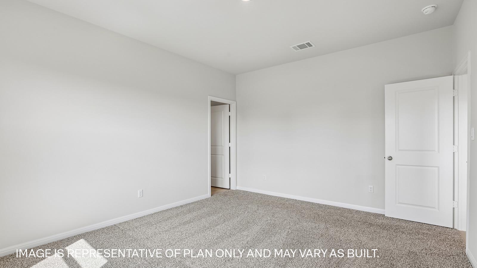 Primary bedroom with ensuite bathroom.