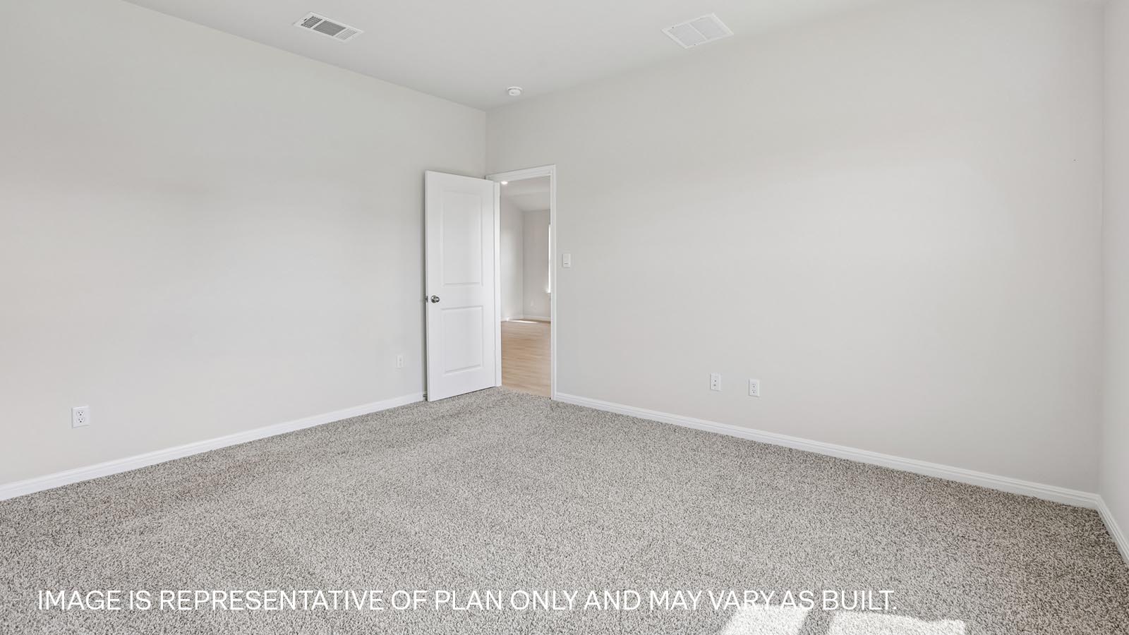 Primary bedroom located off the kitchen.