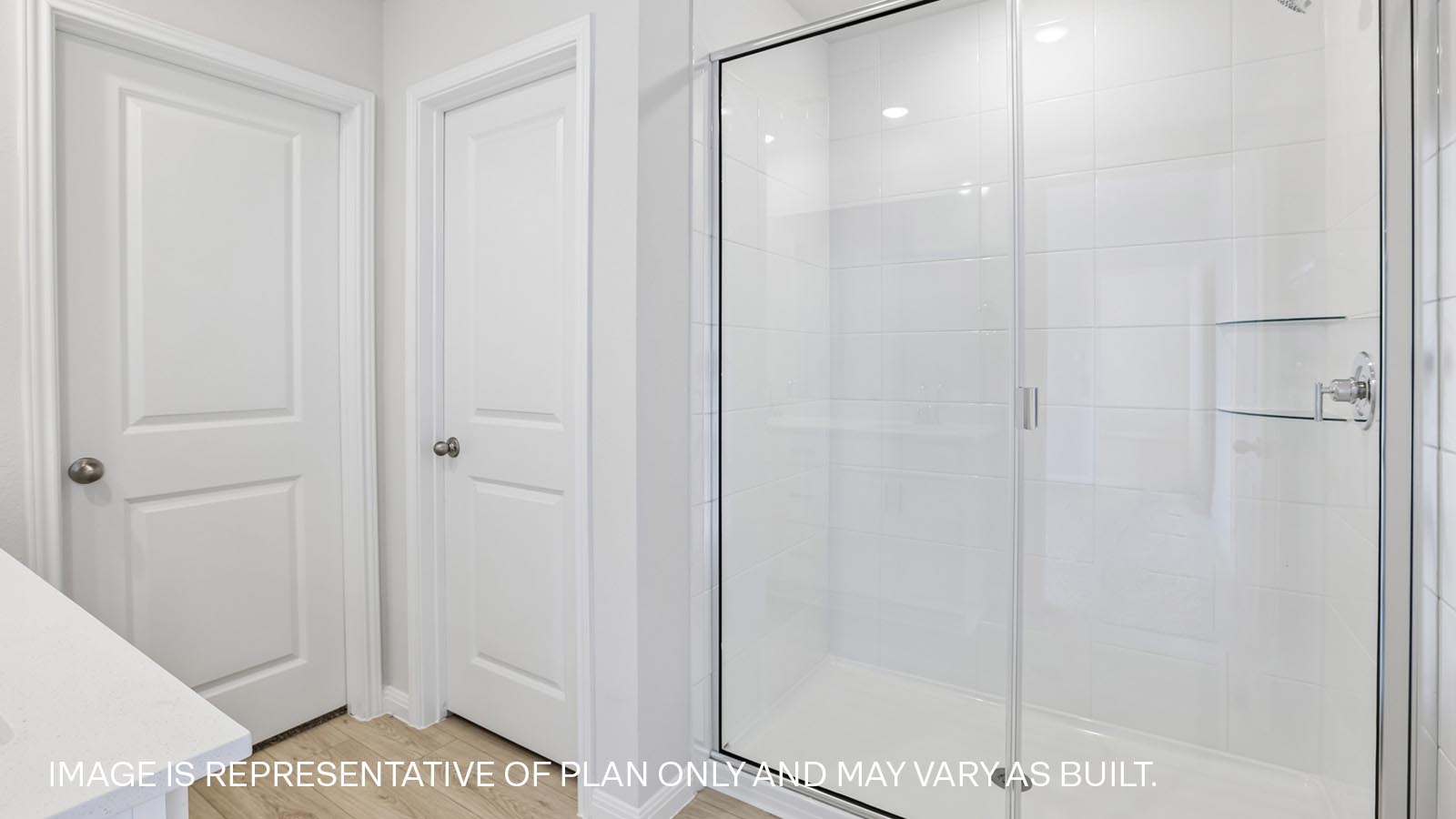 Walk-in shower in primary bathroom.