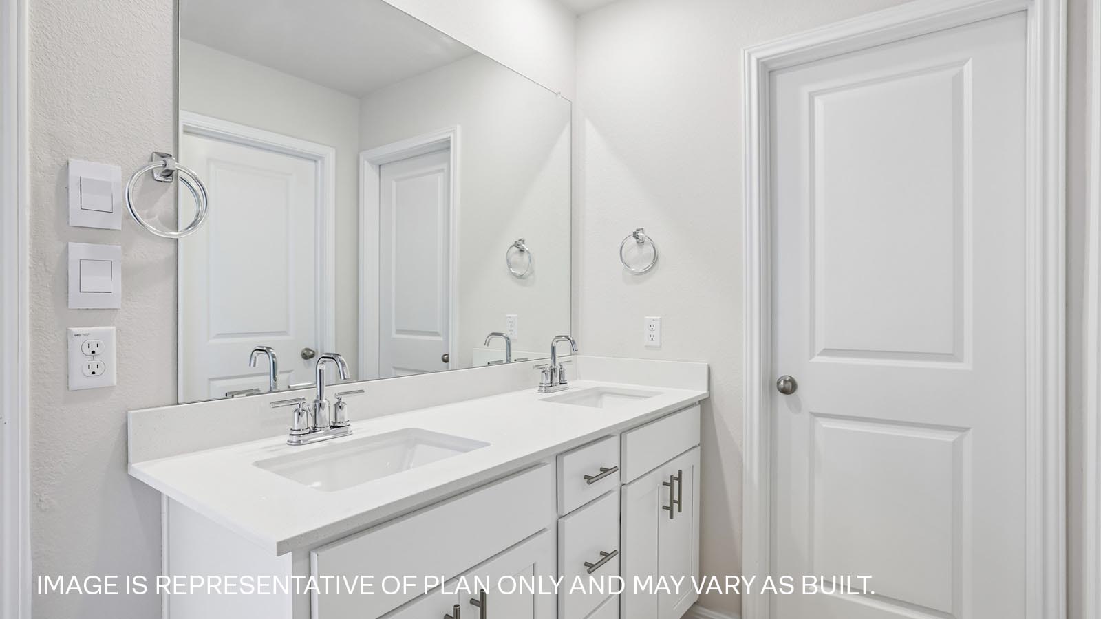 Quartz double vanity sink in primary bathroom.