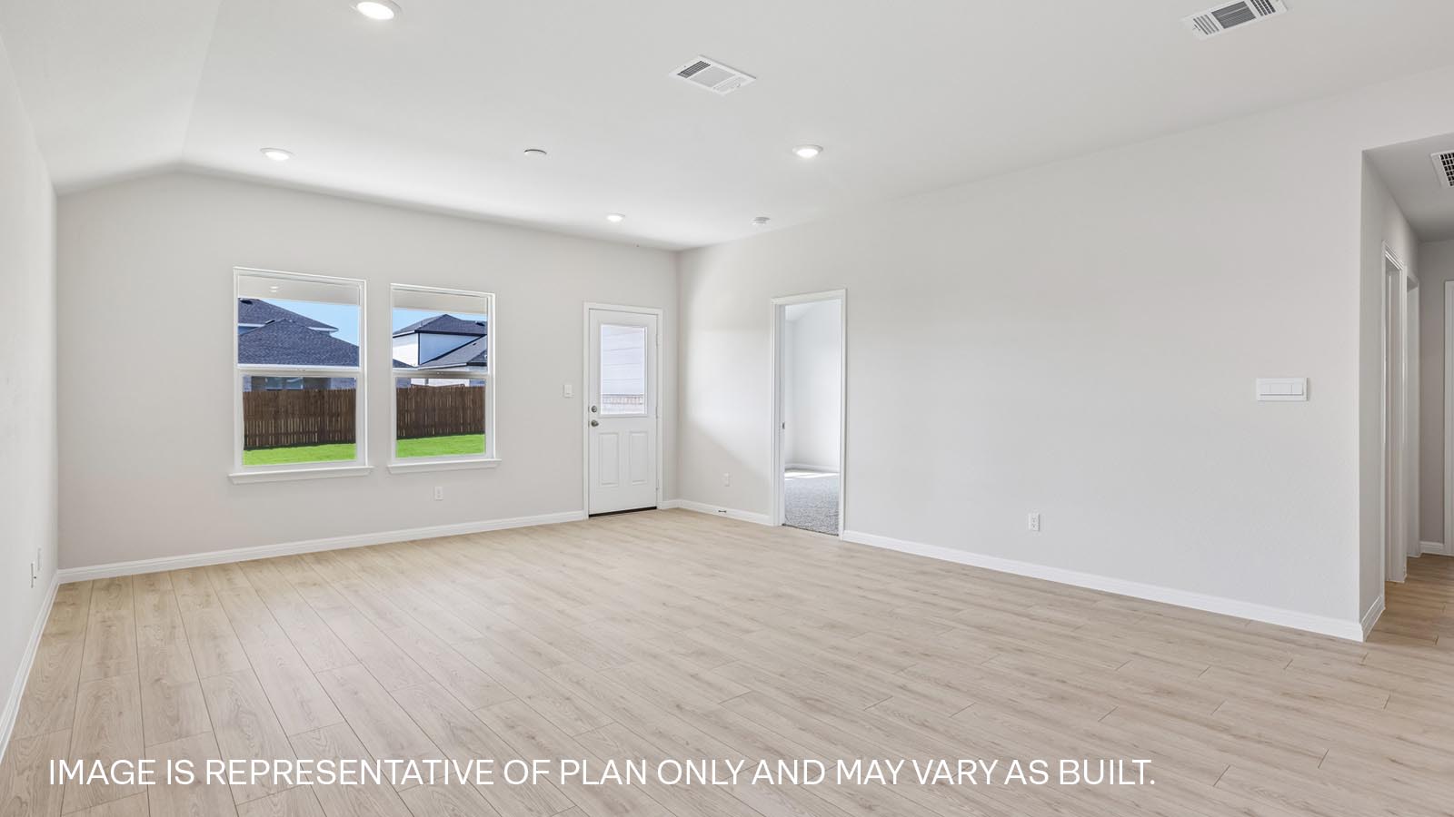 Living area with premium laminate wood plank flooring.