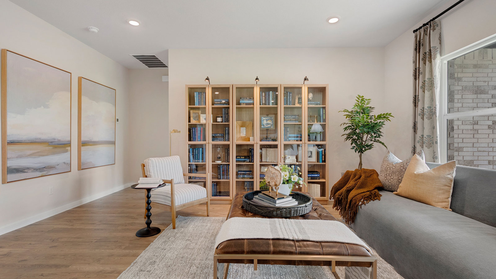 Living area with simple furnishings and an area rug.
